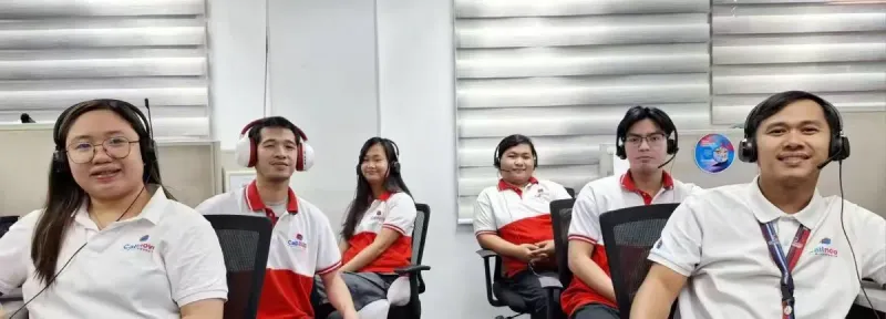 Callnovo agents in uniform with headsets ready for customer calls