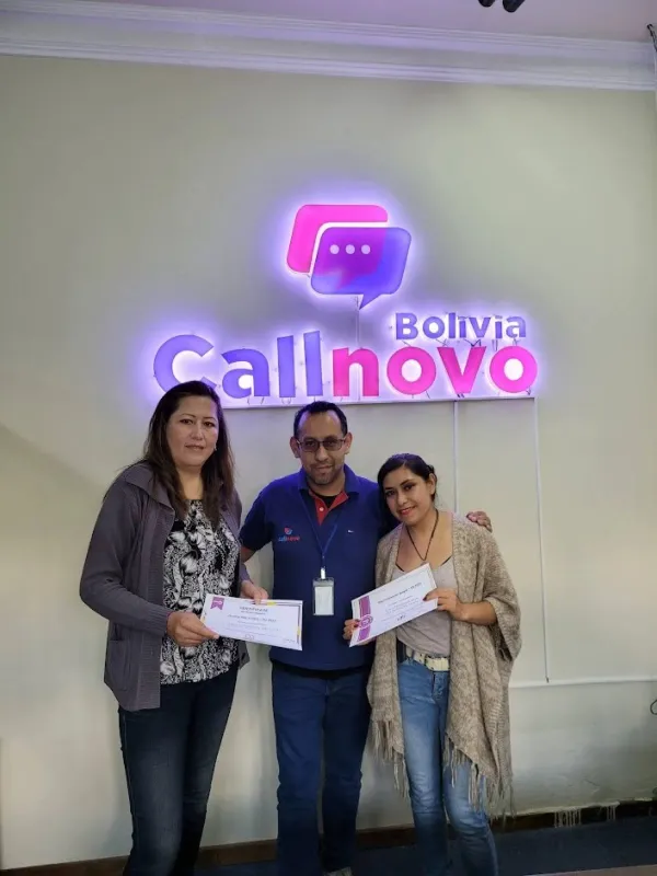 Callnovo employees receiving recognition certificates at Bolivia office