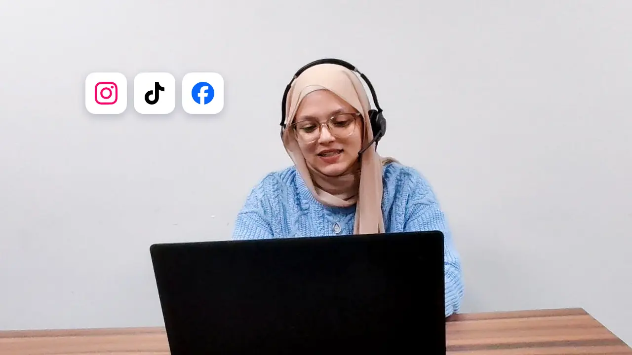 A support agent wearing a headset works on a laptop, with Instagram, TikTok, and Facebook logos beside her — social media customer service outsourcing