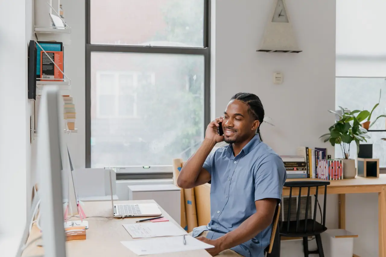 A support agent working a night shift at a lit desk